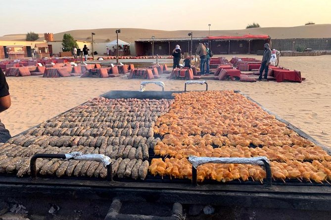 Evening Desert Safari BBQ Dinner With Quad Bike & Sand boarding - Tanura, belly dancing, music, and fire