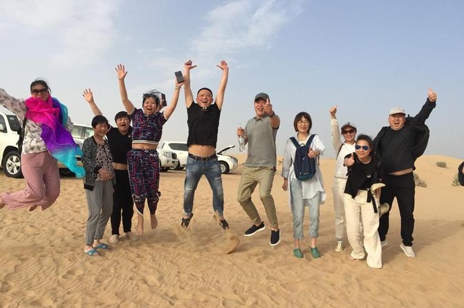 Evening Desert Safari Dubai with BBQ Dinner (Pick Up By Bus) - Sunset photos, sandboarding, and a short camel ride