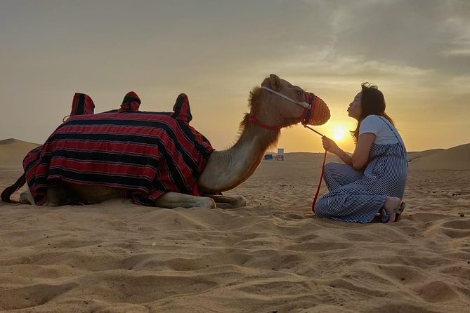 Evening Desert Safari in Dubai, Sandboard & BBQ Dinner - Fire, Tanoura, and belly-dance performances