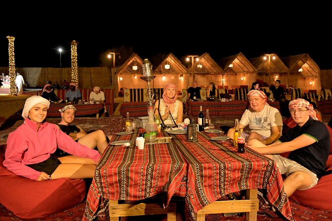 Evening Desert Safari in Dubai, Sandboard & BBQ Dinner - Sandboarding on the red sand
