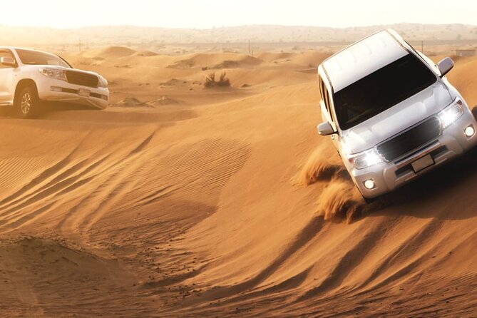 Evening Desert Safari Tour With Dinner & Entertainment - Dune bashing across the red sand