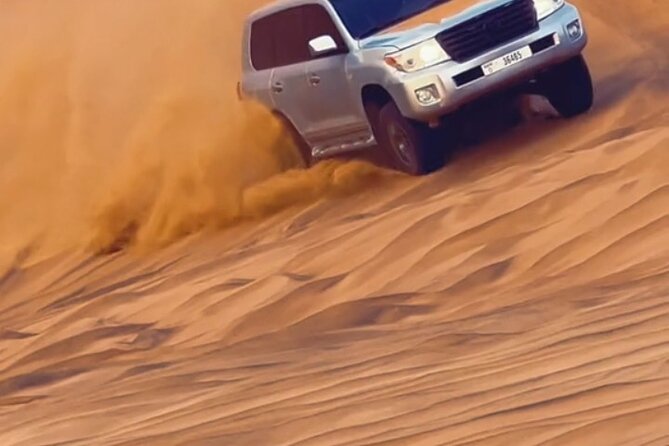 Evening Desert Safari with BBQ Buffet Camel Ride and Arabic Shows - Henna, Arabic clothing, and desert photographs