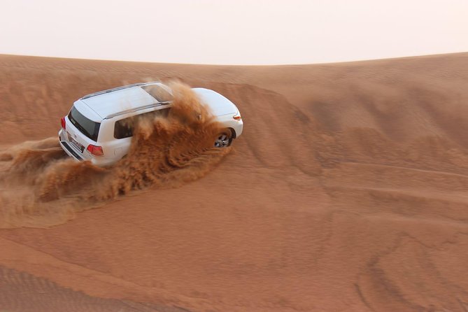 Evening Desert Safari with BBQ Dinner - Sunset photographs and complimentary sandboarding