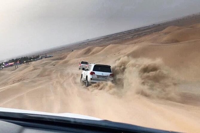 Evening Desert Safari with BBQ Dinner and Live Shows - Sandboarding and the optional motor activities