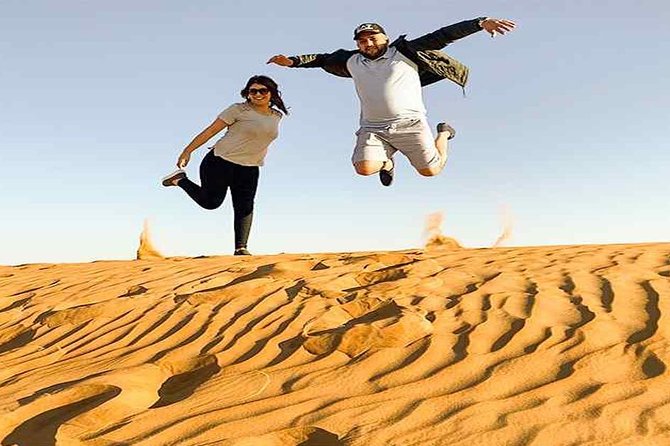 Evening Desert Safari with, Dune Bashing, Camel Ride, sand board - Sandboarding for a quick burst of fun