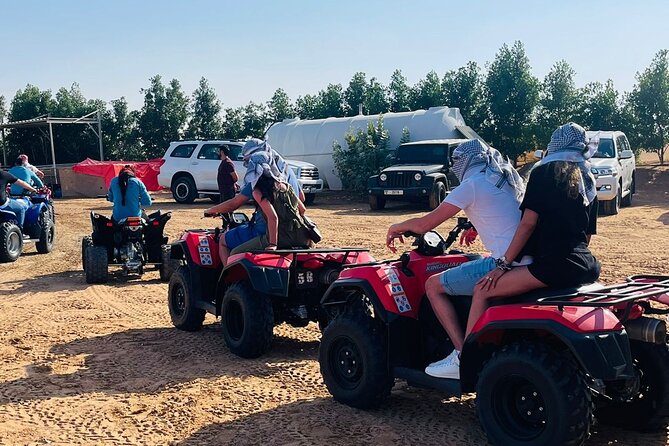 Evening Desert Safari with Quad Bike, Camel Ride & BBQ Dinner - Sandboarding, camel trekking, and the camel farm stop
