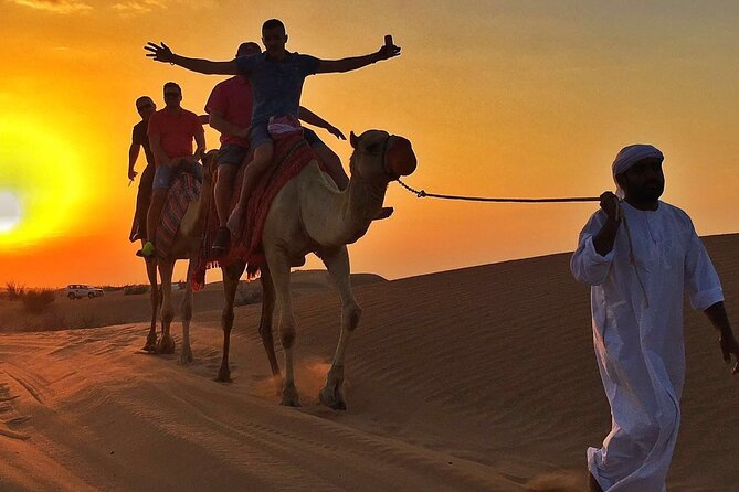 Evening Desert Safari with Quad Bike Experience, BBQ Dinner & Live Shows - Red dunes, dune bashing, and a sandboard run