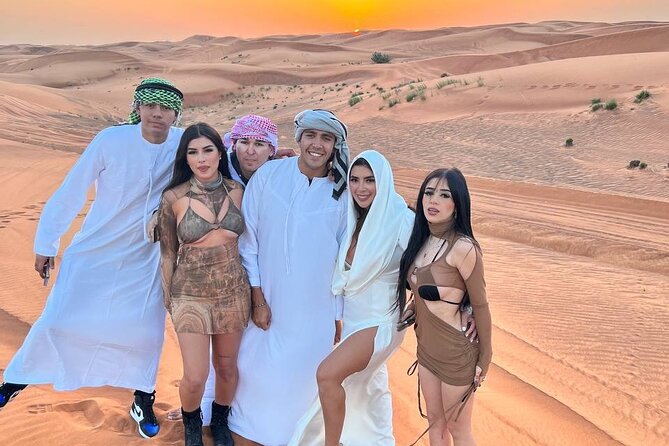 Evening Dubai Safari with BBQ, Dance Shows & Quad Biking optional - Sandboarding and sunset photos slow the pace