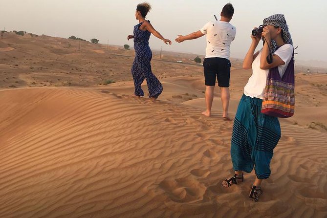 Evening Red Dunes Desert Safari: BBQ Dinner & Adventure Awaits! - Belly dancing, Tanoura, and the fire show
