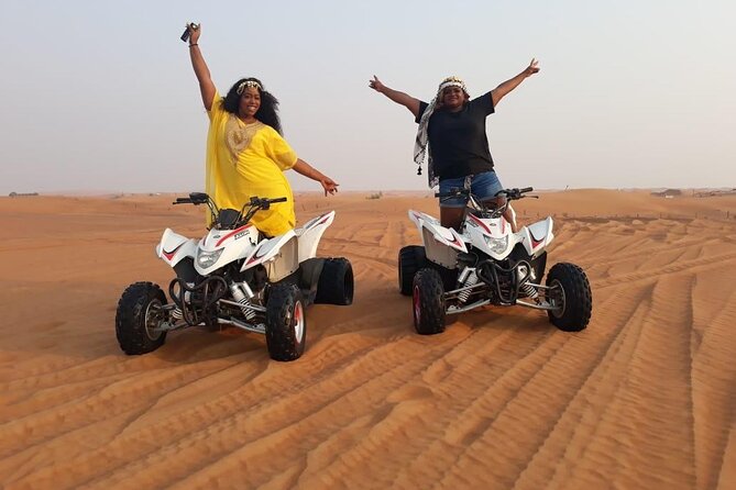 Evening Red Dunes Safari with Quad Biking, BBQ Dinner & LiveShows - Camel riding, sandboarding, and desert photographs