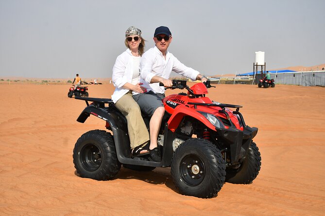 Experience Dubai Best Red Dune Evening Desert Safari BBQ Dinner - Sand-boarding and the sunset photo stop