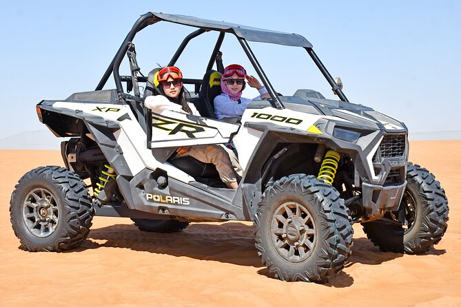Experience Dubai Best Red Dune Evening Desert Safari BBQ Dinner - Camel riding, falcon photography, and henna