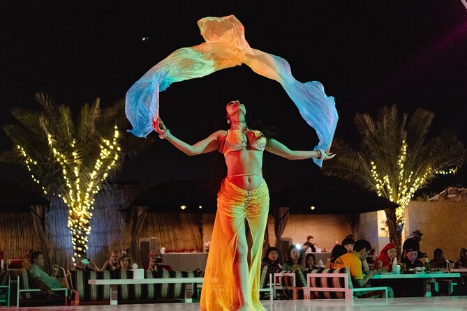 Experience Red Dune Safari Shows, Camels, BBQ & ATV Bike in Dubai - A short camel ride at the camp
