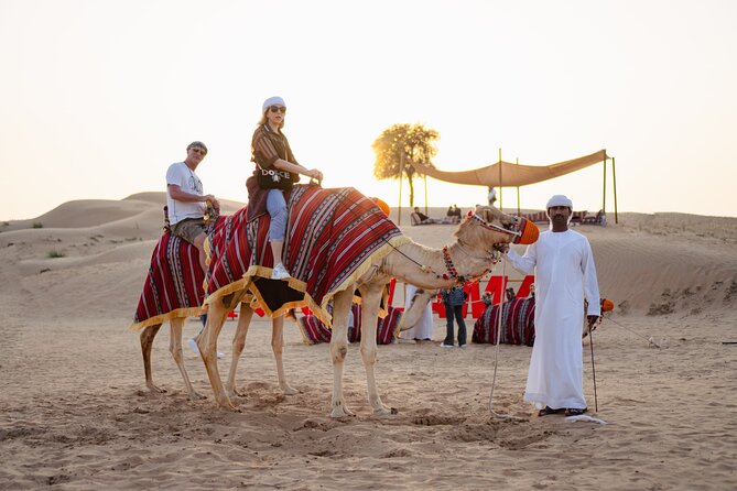 Experience Red Dune Safari Shows, Camels, BBQ & ATV Bike in Dubai - Quad biking across the red sand