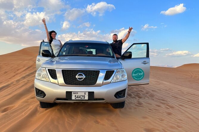 Experience the Ultimate Dubai Red Dunes Desert Safari BBQ Dinner - Sandboarding, camel riding, and the falcon stop