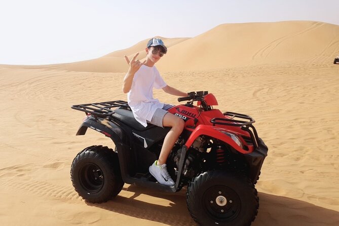 Extreme Quad Driving Adventure Tour - Sandboarding, camel riding, and photo stops