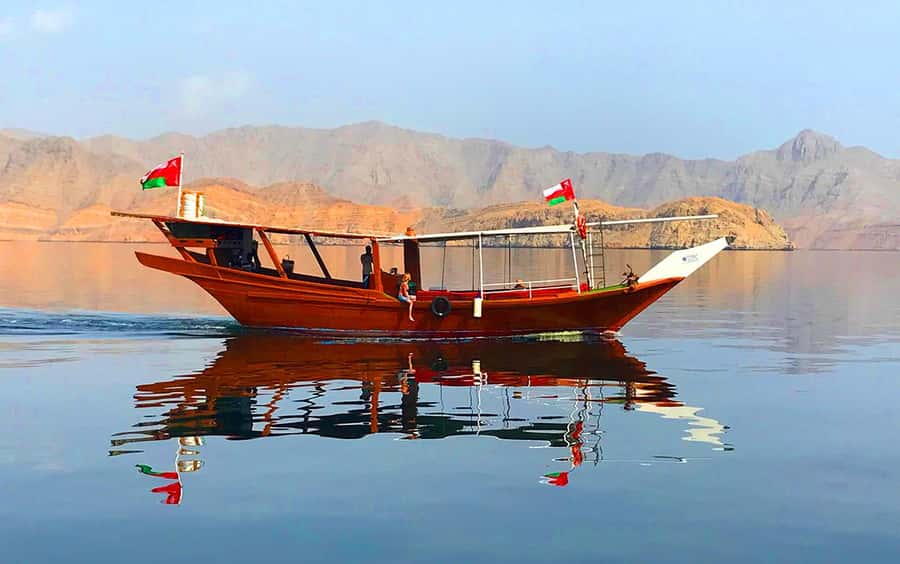 From Ras al Khaimah: Musandam Khasab Day Trip with Transfer - Boarding a handcrafted wooden dhow