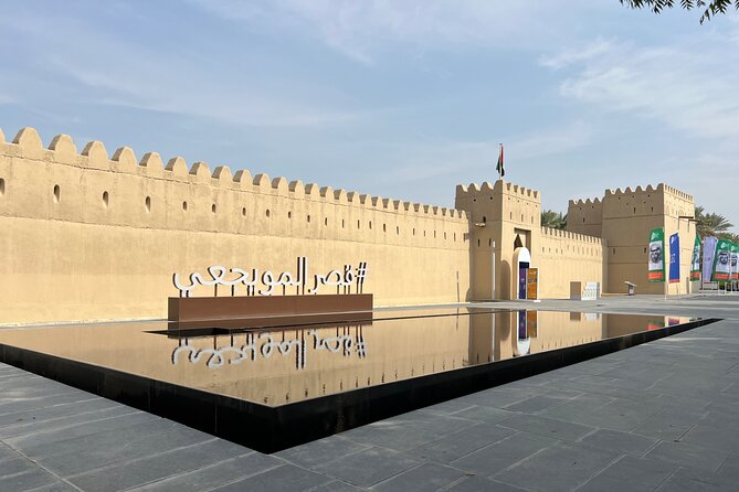 Full Day Al Ain City Tour with Lunch - Al Ain Oasis: shade, palms, and old irrigation