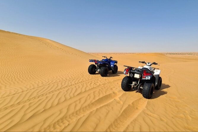 Guided Desert Safari with Dinner and Quad Biking in Dubai - Sunset photos, camel riding, and sandboarding