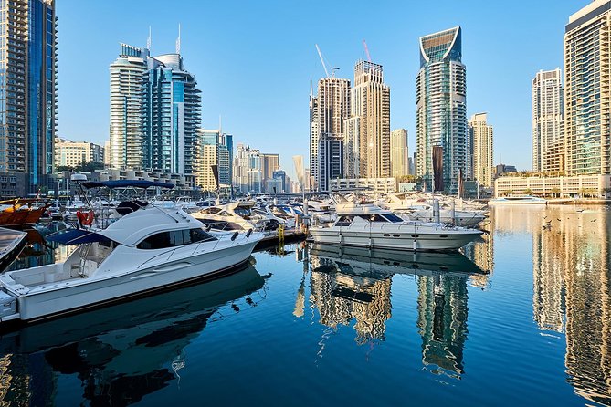 Half-Day Dubai City Tour with Blue Mosque, Creek, Souks & Abra - Crossing Dubai Creek by abra