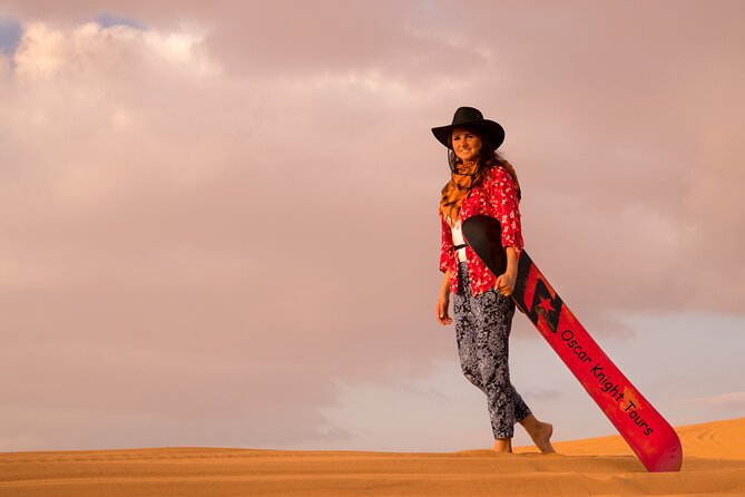 High Red Dunes with Camel Ride, Sandboarding, Falcon Show and VIP BBQ Dinner - BBQ buffet, VIP treatment, and evening shows