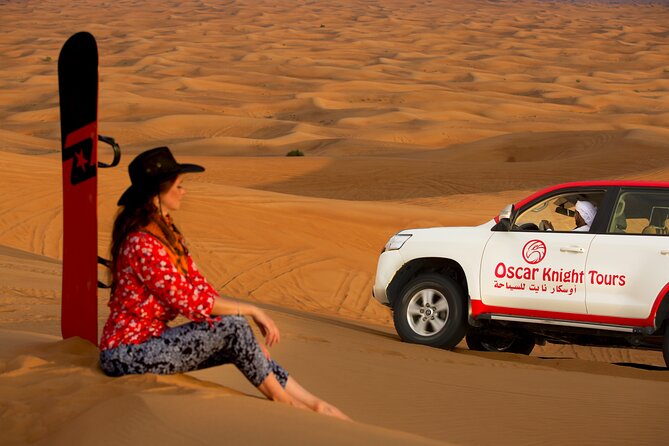 High Red Dunes with Camel Ride, Sandboarding, Falcon Show and VIP BBQ Dinner - Lahbab’s 30 to 45 minutes of dune bashing