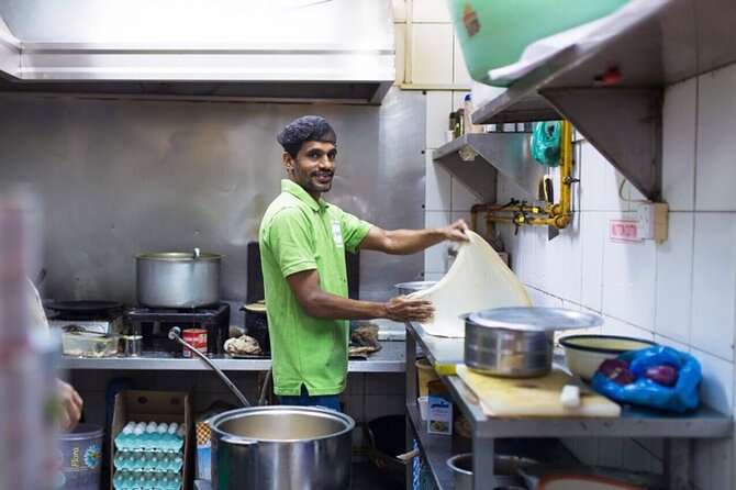 Local Street Food and Guided Walking Tour of Dubai Old Town - Textile Souk colors and bargaining