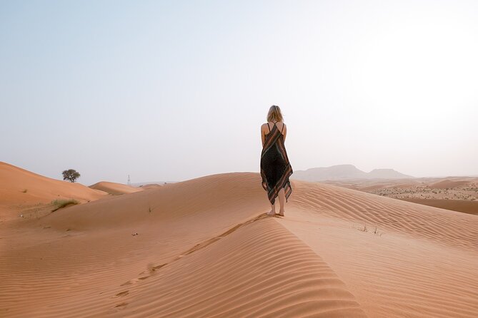 Morning Desert Safari From Abu Dhabi -Camel Ride,Sand Boarding,Camel Farm Visit - Sandboarding down the golden dunes
