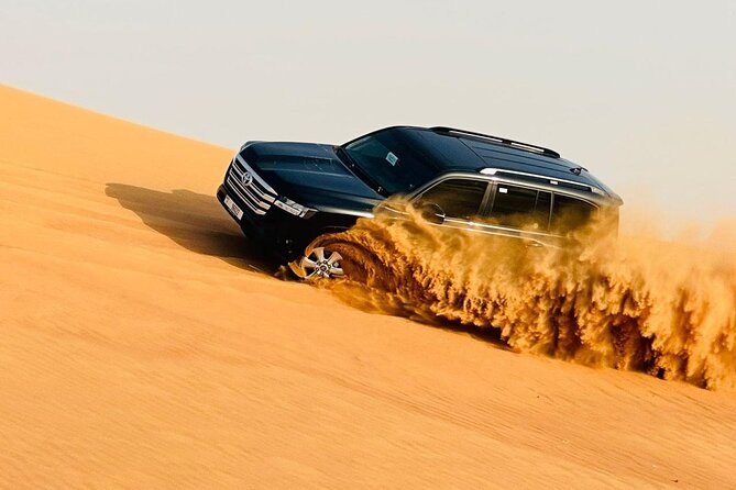 Morning Desert Safari, Quad Bike, Dunes Bashing and Camel Ride - Sandboarding on the dunes