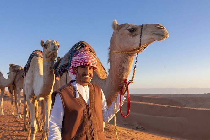 Morning Desert Safari with Quad Bike, Camel Ride & Sandboarding - Sandboarding Down the Dunes