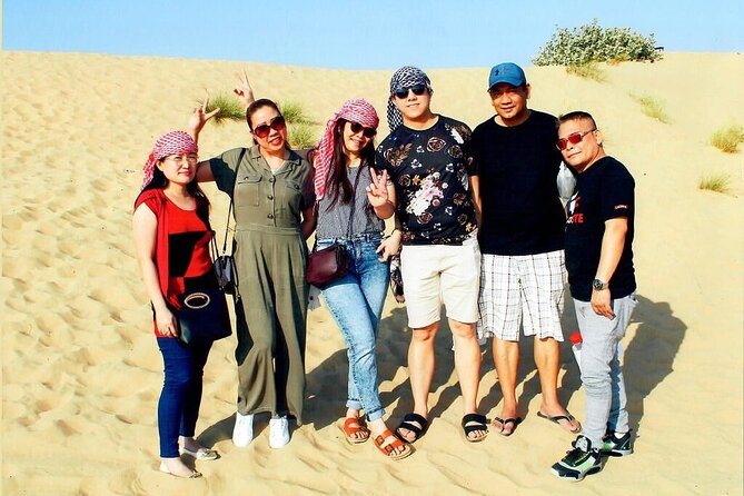 Morning Dubai desert safari - camel rides, quad bikes, dune buggies,dune bashing - Sandboarding adds a simple second thrill