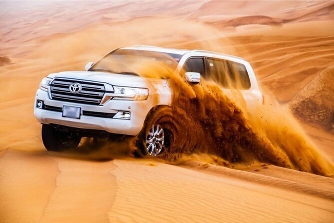 Premium Desert Safari: BBQ, Quad Bike & Sandboarding - The desert camp shifts from adventure to dinner