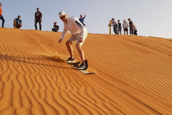 Private Desert Safari Red Dune with BBQ, Sand Boarding and Camel Ride - Sunset over the Lahbab desert