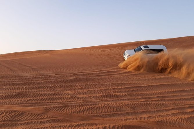 Private Desert Safari Red Dune with BBQ, Sand Boarding and Camel Ride - Arabian-style camp, shisha, henna, and coffee