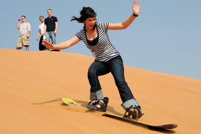 Private Desert Safari Red Dunes with BBQ,Camel Ride,Sand Boarding,Live Shows - A short camel ride, then sandboarding