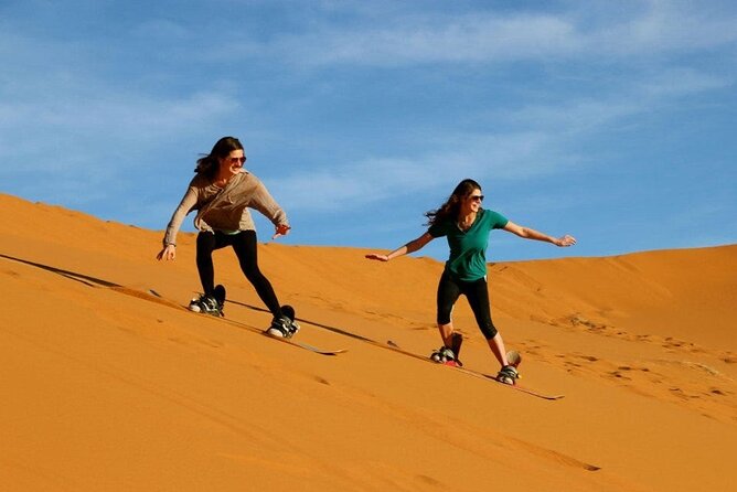 Private Evening Red Sand Desert Safari with BBQ Dinner - Sunset above Lahbab’s orange dunes