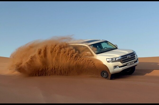 Red Dunes Desert Safari Dubai with Dinner Buffet, Show & Transfer - Sandboarding and the very short camel ride