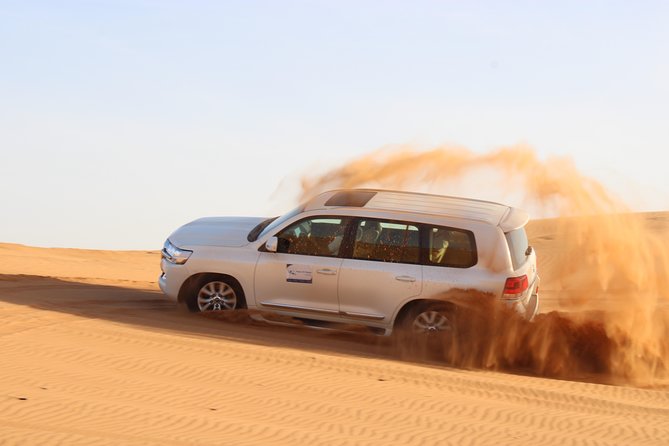 Red Dunes Desert Safari, Sand Board, Camel Ride with BBQ Dinner - Key points at a glance