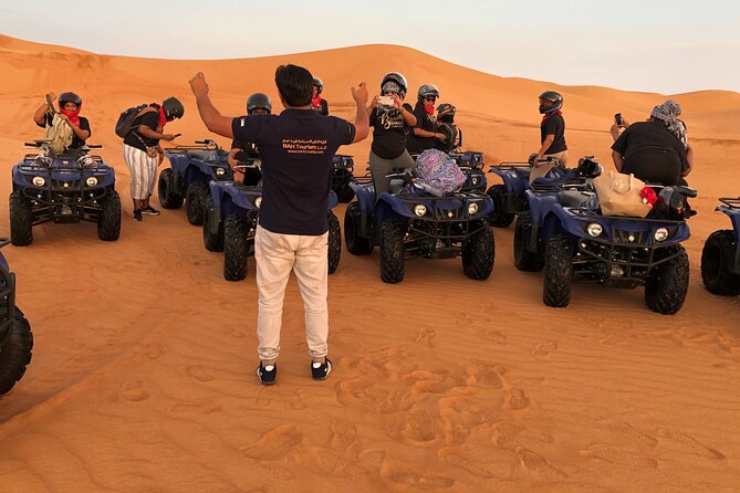 Self-drive Quad Bike with Sand Boarding and Camel Ride in Dubai - Riding an automatic quad bike across the Dubai desert