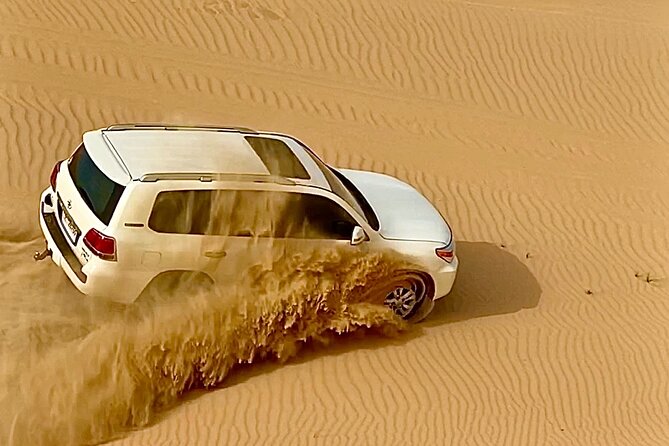 Sunrise Desert Safari from Abu Dhabi - Camel riding, sandboarding, and quad biking