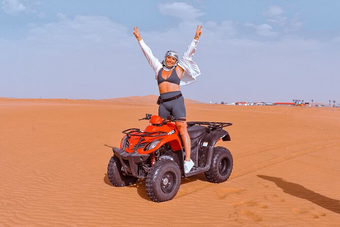 Sunset Desert Safari Quad bike Camel ride Sand Board & BBQ Dinner - Quad biking at Al Lahbab