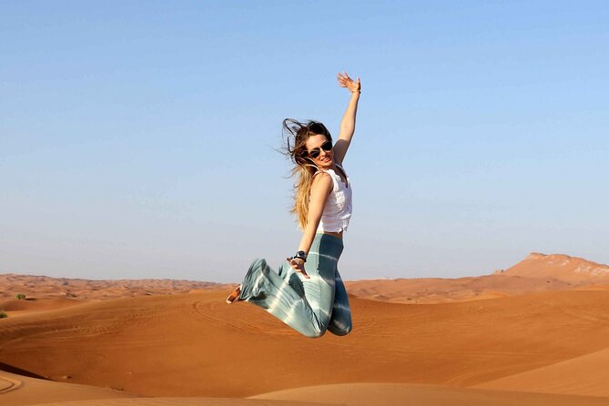 Thrilling Desert Safari Dubai Adventure with Sand Boarding and Barbecue Dinner - Camel riding, henna, and Arabic coffee