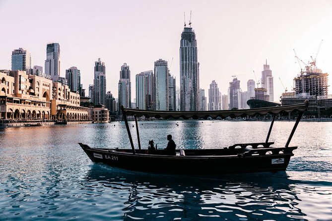 Traditional Abra Ride and Dubai Fountain Show at Burj Lake - Burj Khalifa and Downtown after sunset
